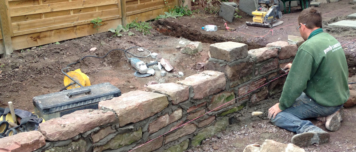 Building a garden wall from stone 